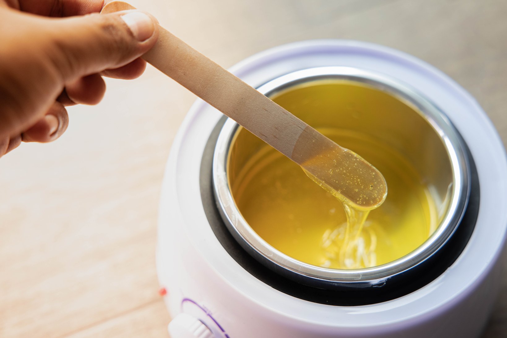 Person Using Hot Wax 