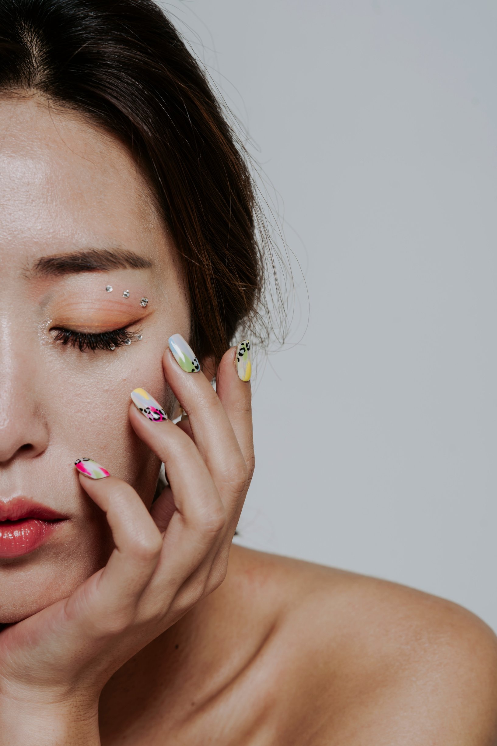 Woman with Makeup Showing Nail Art